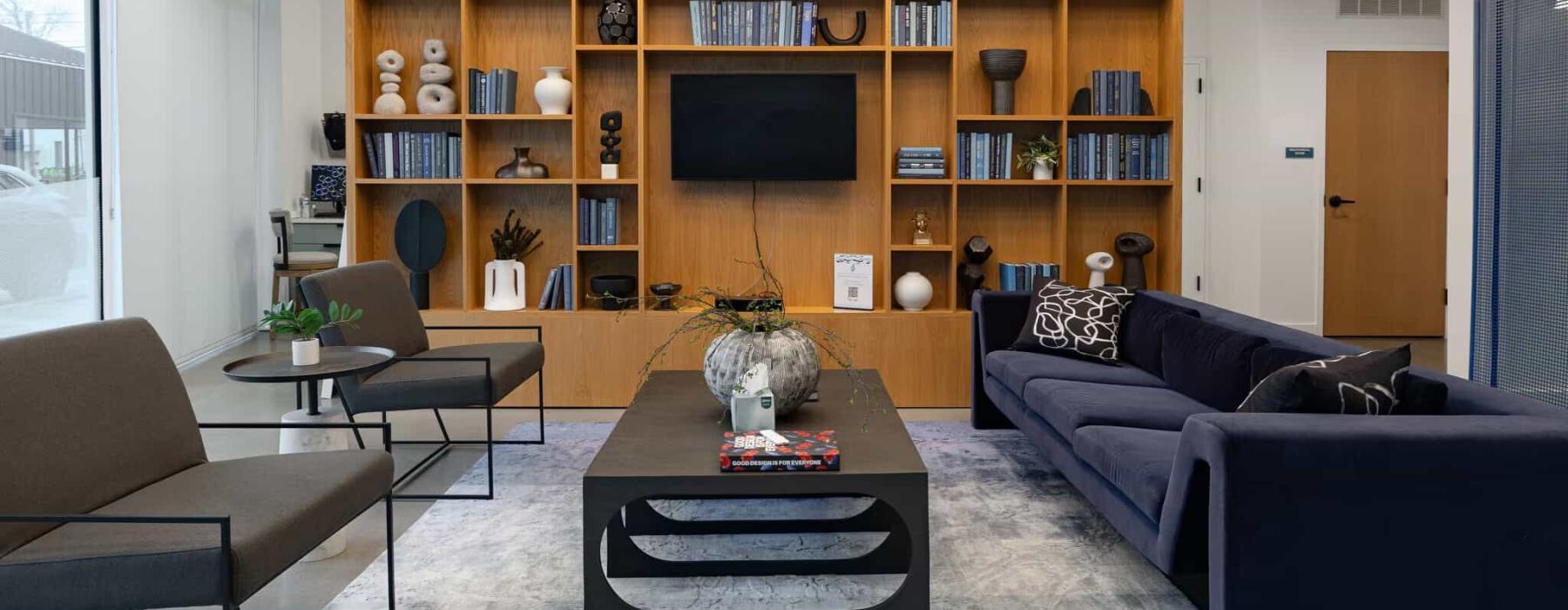 a spacious lounge with a media area