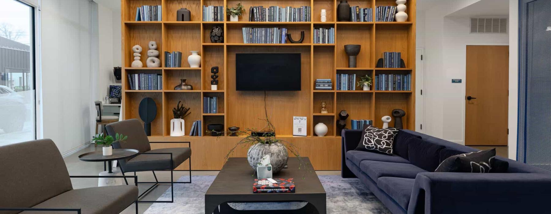 a spacious lounge with a media area