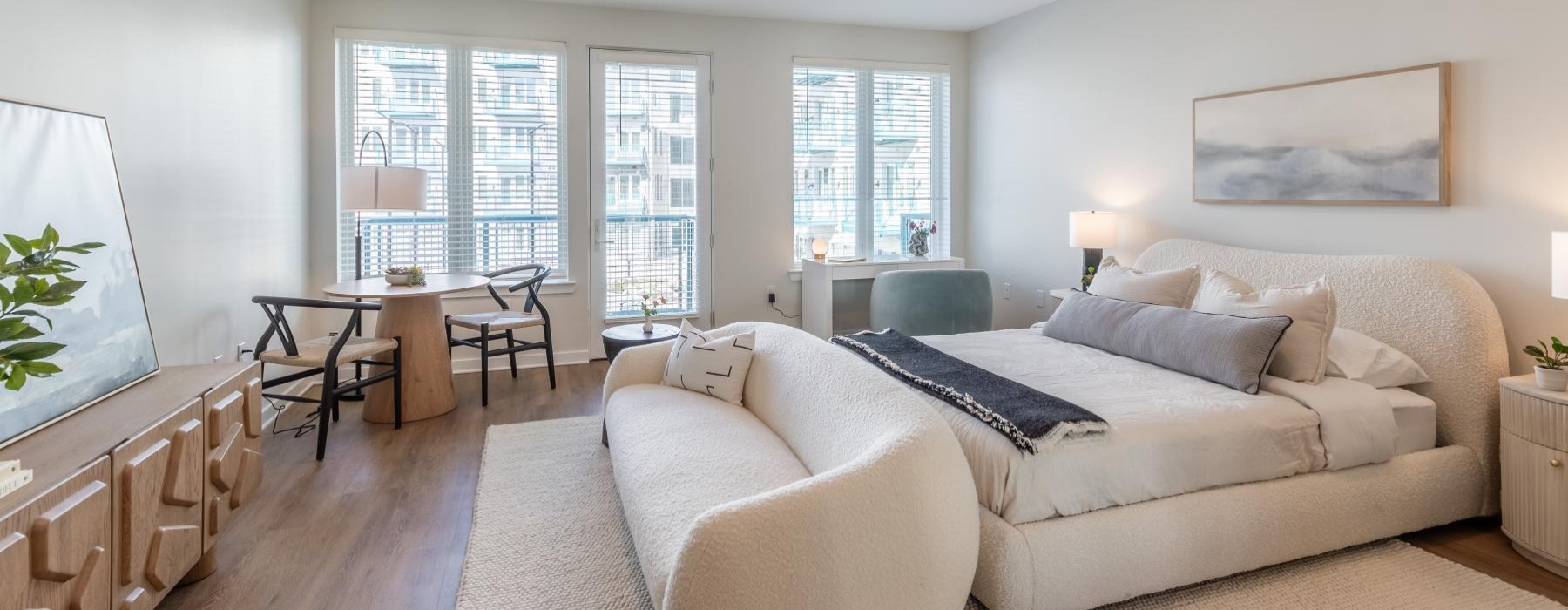 a large bedroom with a large window