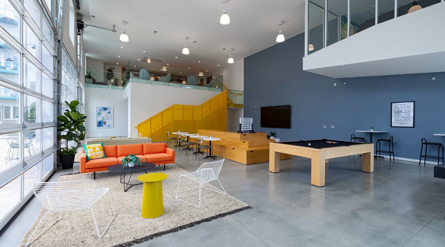 Beautiful clubroom with lounge seating and billiards and media areas